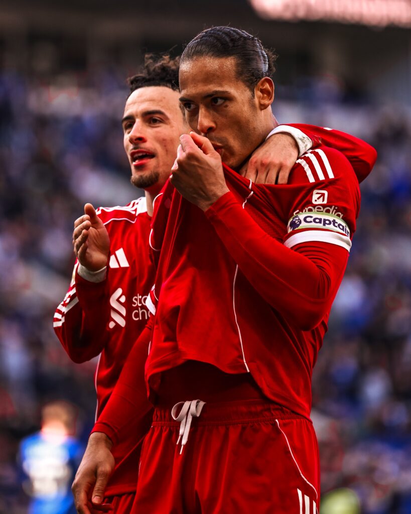 Liverpool players celebrating Merseyside derby win vs Everton