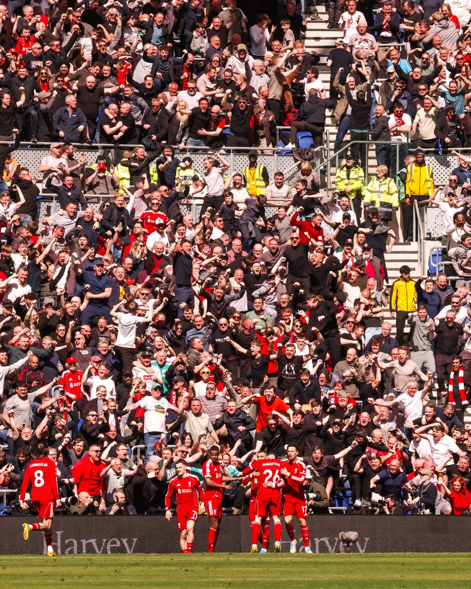 Liverpool players celebrating Merseyside derby win vs Everton