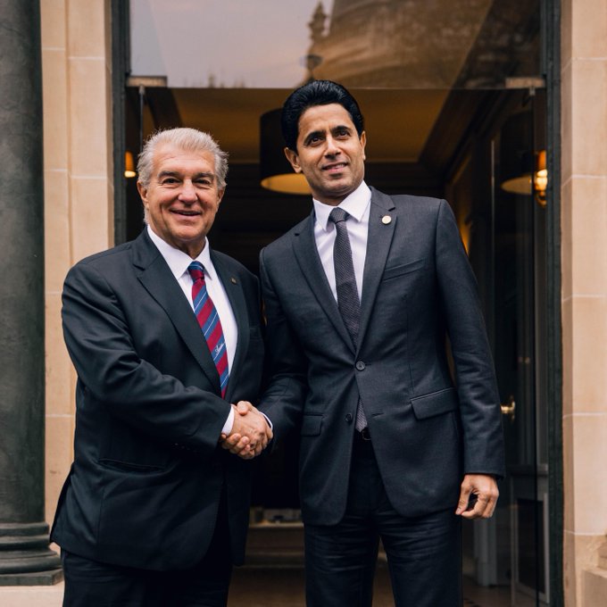 Barcelona president Joan Laporta and PSG president Nasser Al-Khelaifi shake hands ahead of their Champions League match in Paris.